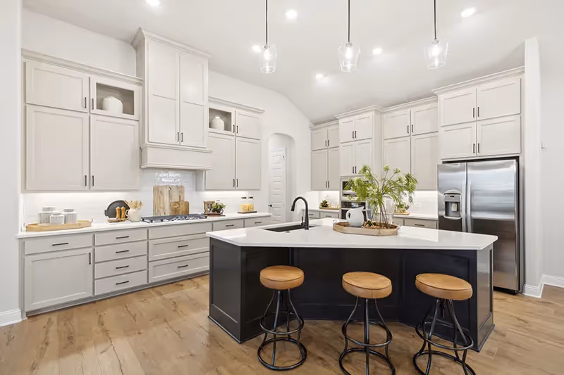 kitchen with angled island and white cabinets