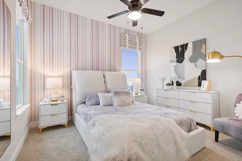 light pastel decorated bedroom with carpet and white walls