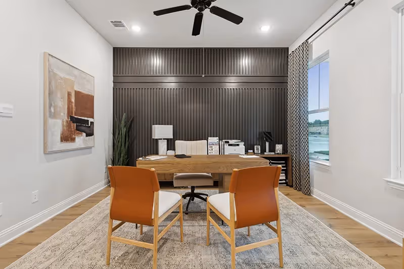 study that we turned into a sales office with a dark accent wall