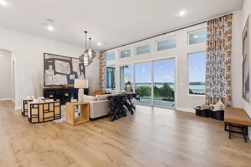 living area with vinyl wood flooring and sliding glass doors to patio