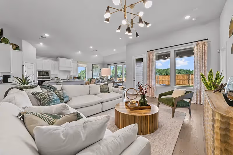 living room that opens to dining and kitchen area