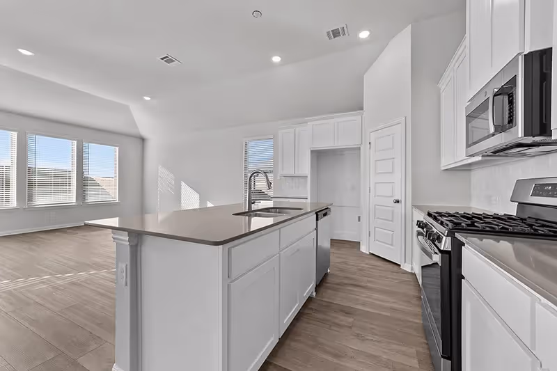 kitchen with island and built in microwave