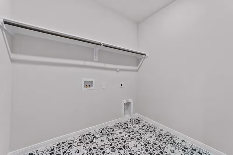 laundry room with pattern tile