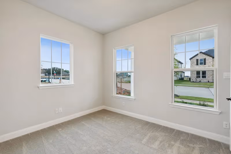 bedroom with carpets and windows
