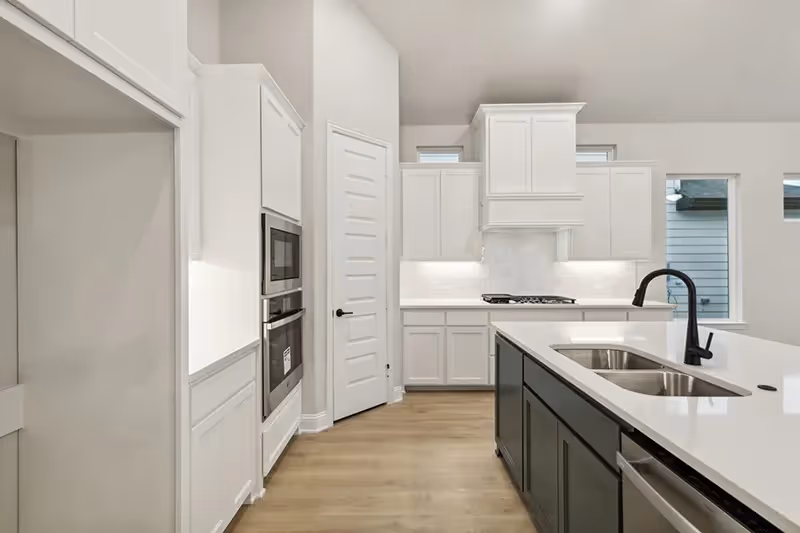 kitchen with island and white cabinets