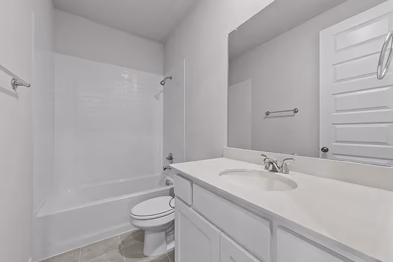 bathroom with one sink and toilet and tub/shower
