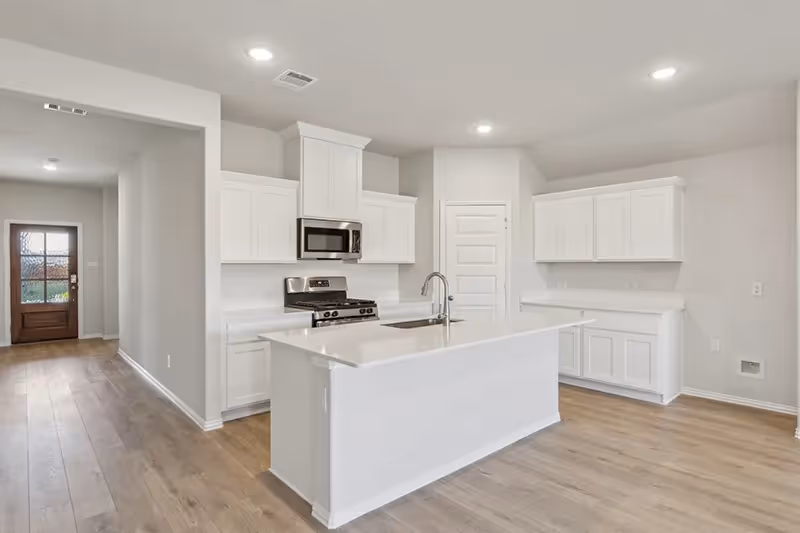 kitchen with white cabinets and countertops