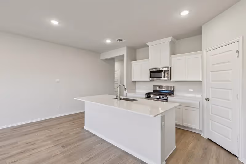 kitchen with white cabinets and countertops