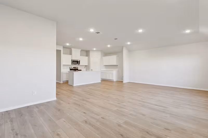 open concept living and dining area with view of kitchen
