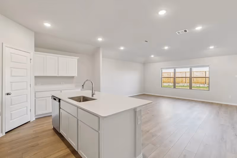 open concept kitchen, living and dining area