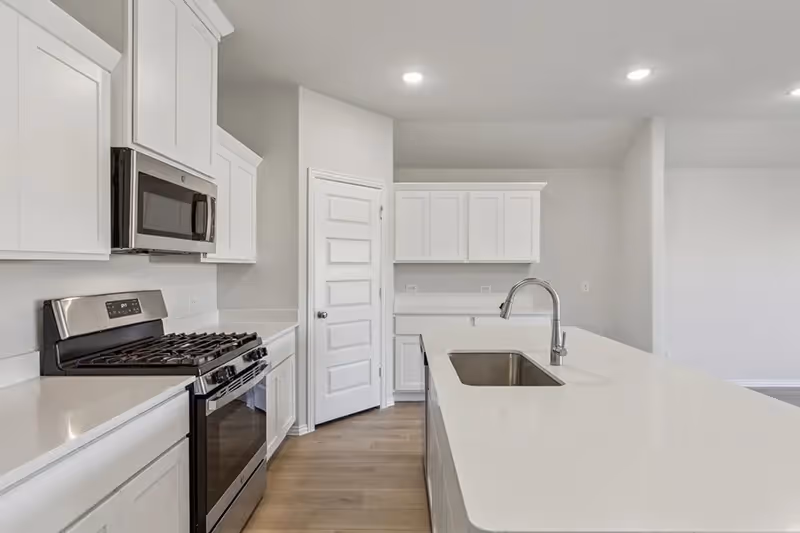 kitchen with white cabinets and countertops