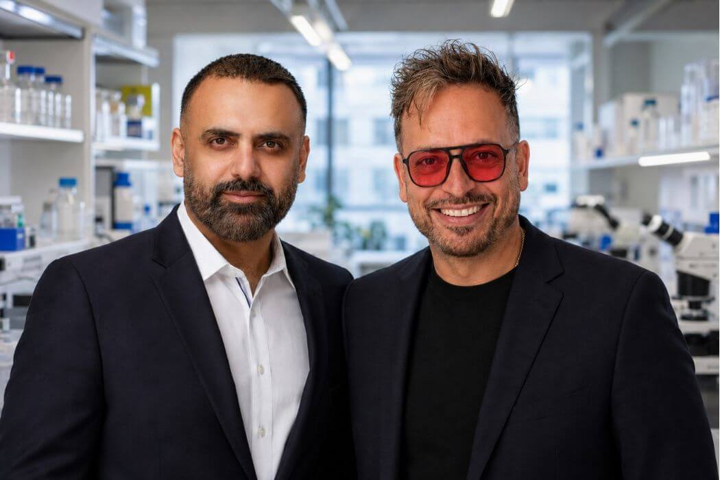 Co-founders of Scispot, Guru Singh and Satya Singh, standing together and facing the camera.