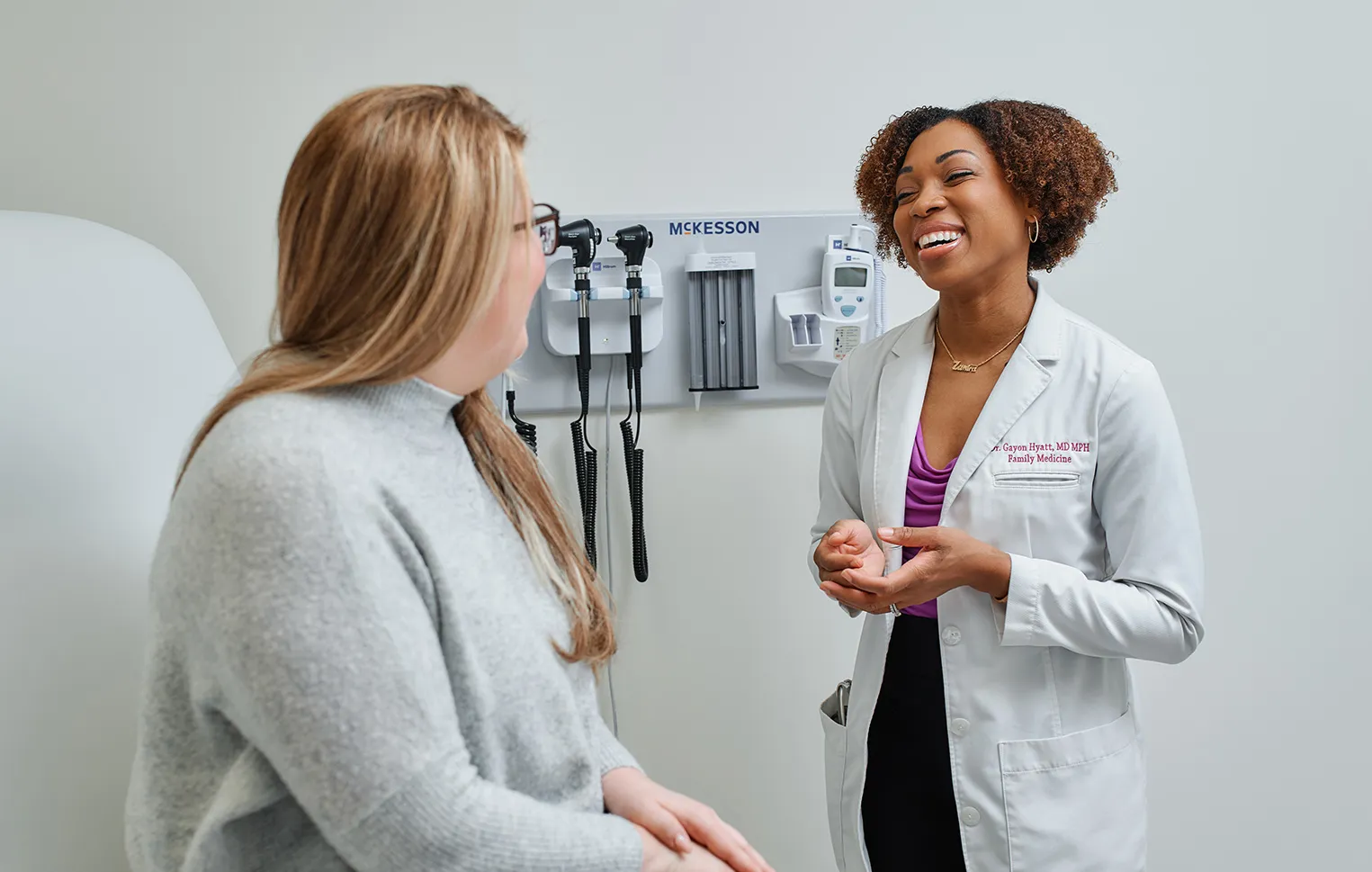 The best primary care doctor in East Brunswick, NJ, consults with a patient at a health checkup appointment