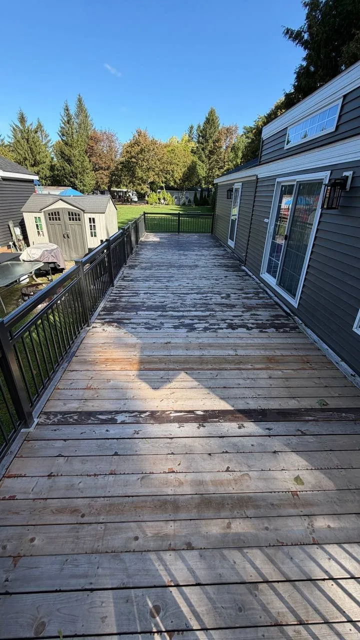 Deck Refinishing in Whitchurch-Stouffville: Long Pressure-Treated Deck Sanded and Restained with an Oil-Based Stain