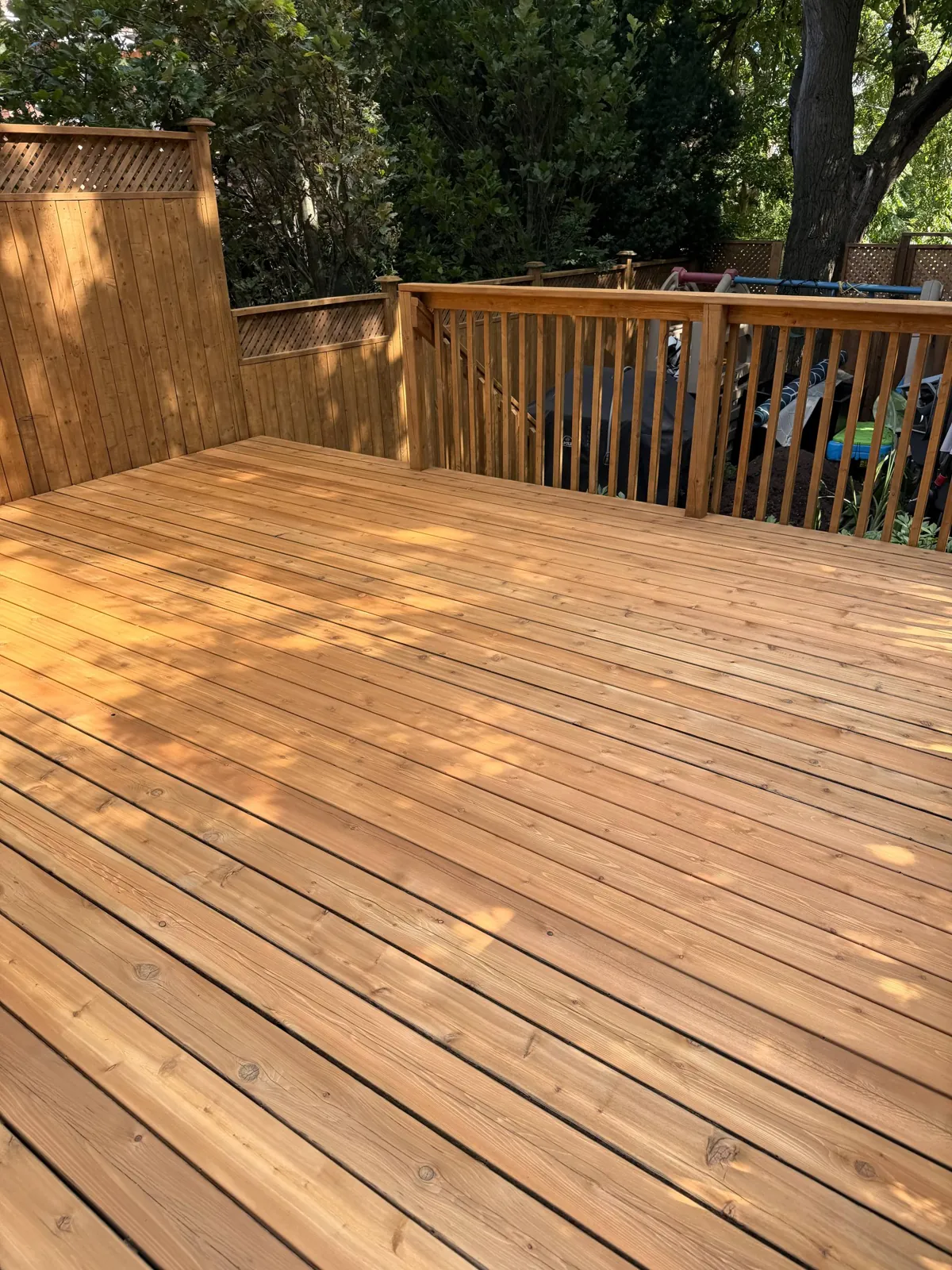 Cedar Deck Restoration in Toronto: Rotted Boards Replaced, Deck and Privacy Screen Sanded and Stained in C2 Guard Ponderosa