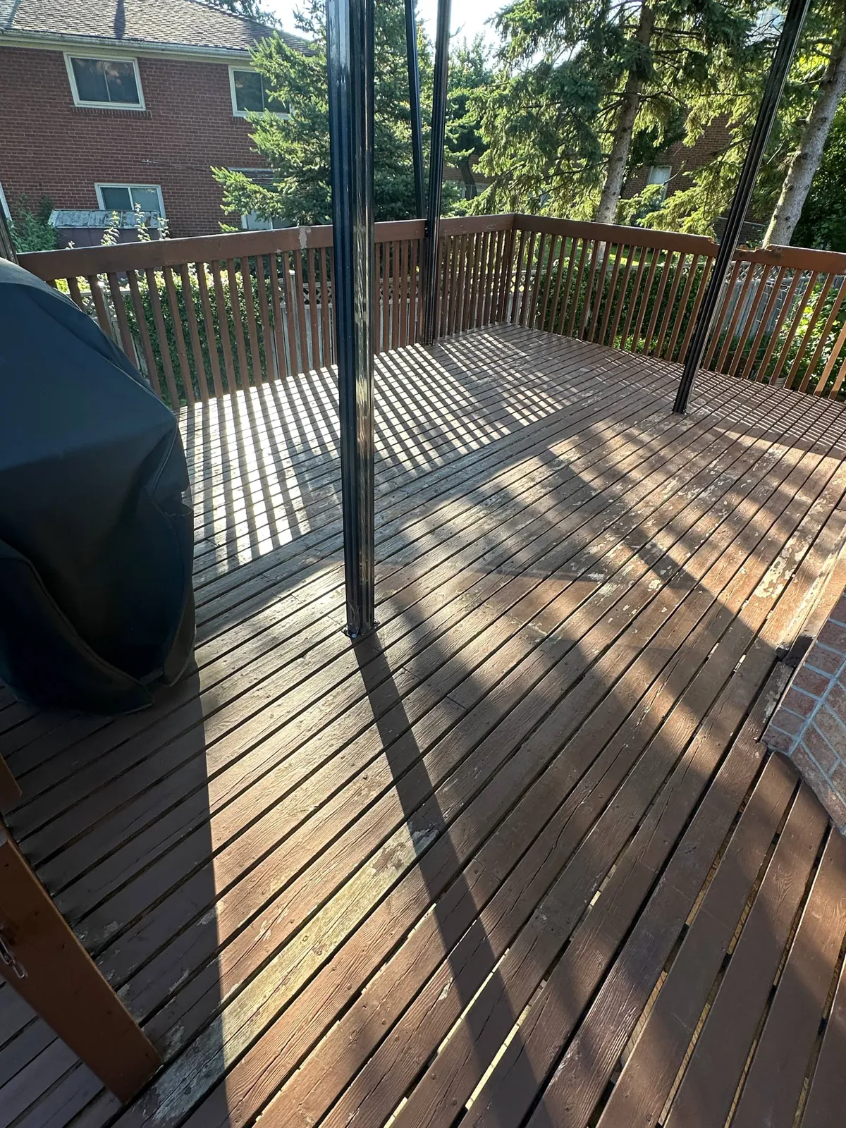 Covered Deck Restoration in North York: Peeling Solid Stain Sanded Off, Deck Refinished in Semi-Transparent Oil Stain, Railings Refreshed