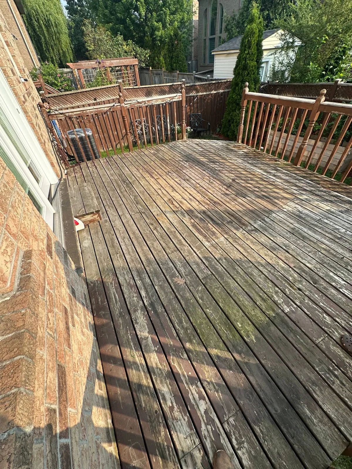 Deck Restoration in Oakville: Rotten Boards Replaced, Peeling Stain Sanded Off, Oil-Based Finish with Refreshed Black Railings