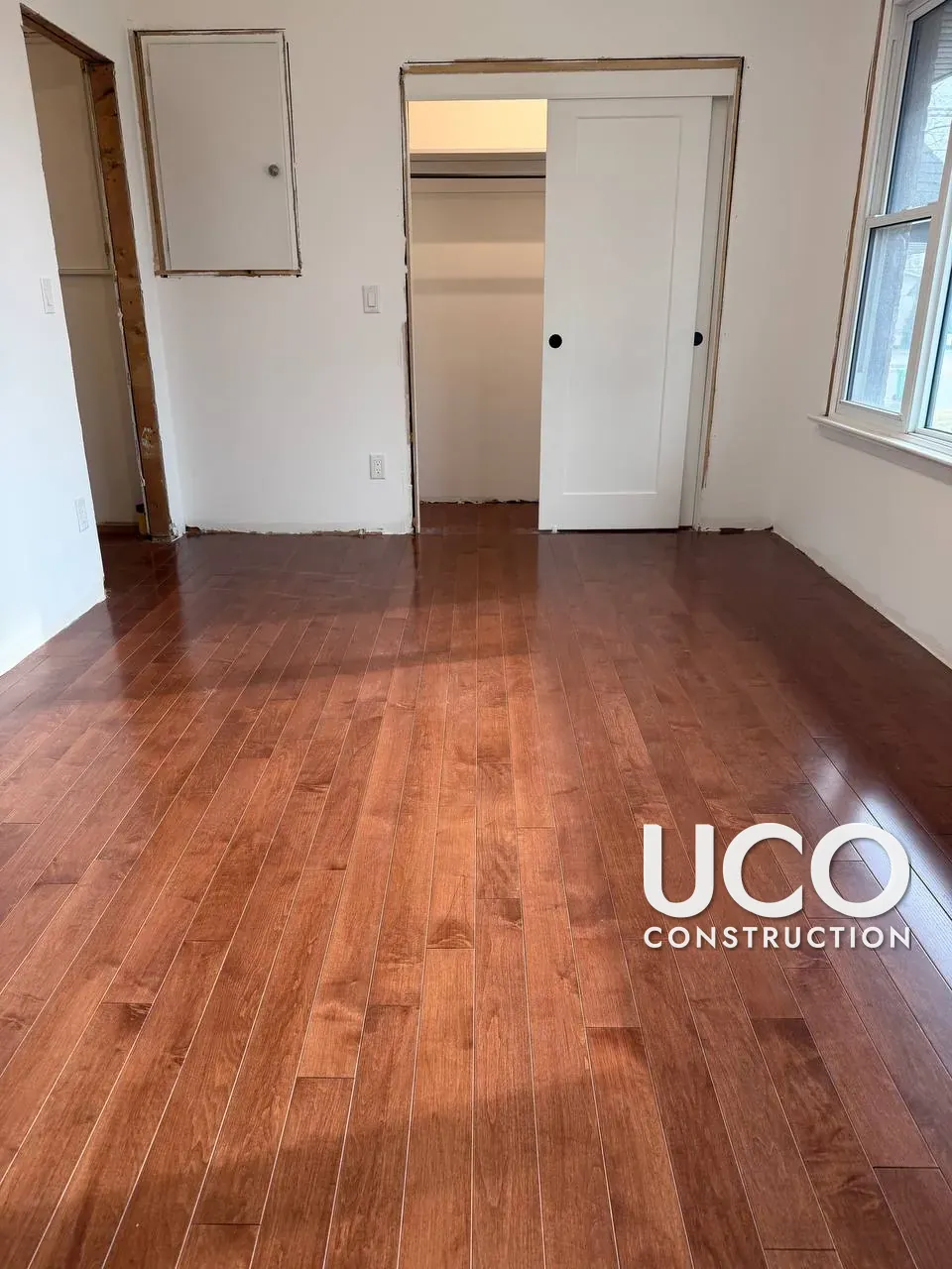Hardwood Floor Refinishing in Mississauga: Red-Stained Maple Floor Sanded to Bare Wood, Trowel-Filled and Finished With a Natural Clear Sealer for a Light Scandinavian Look