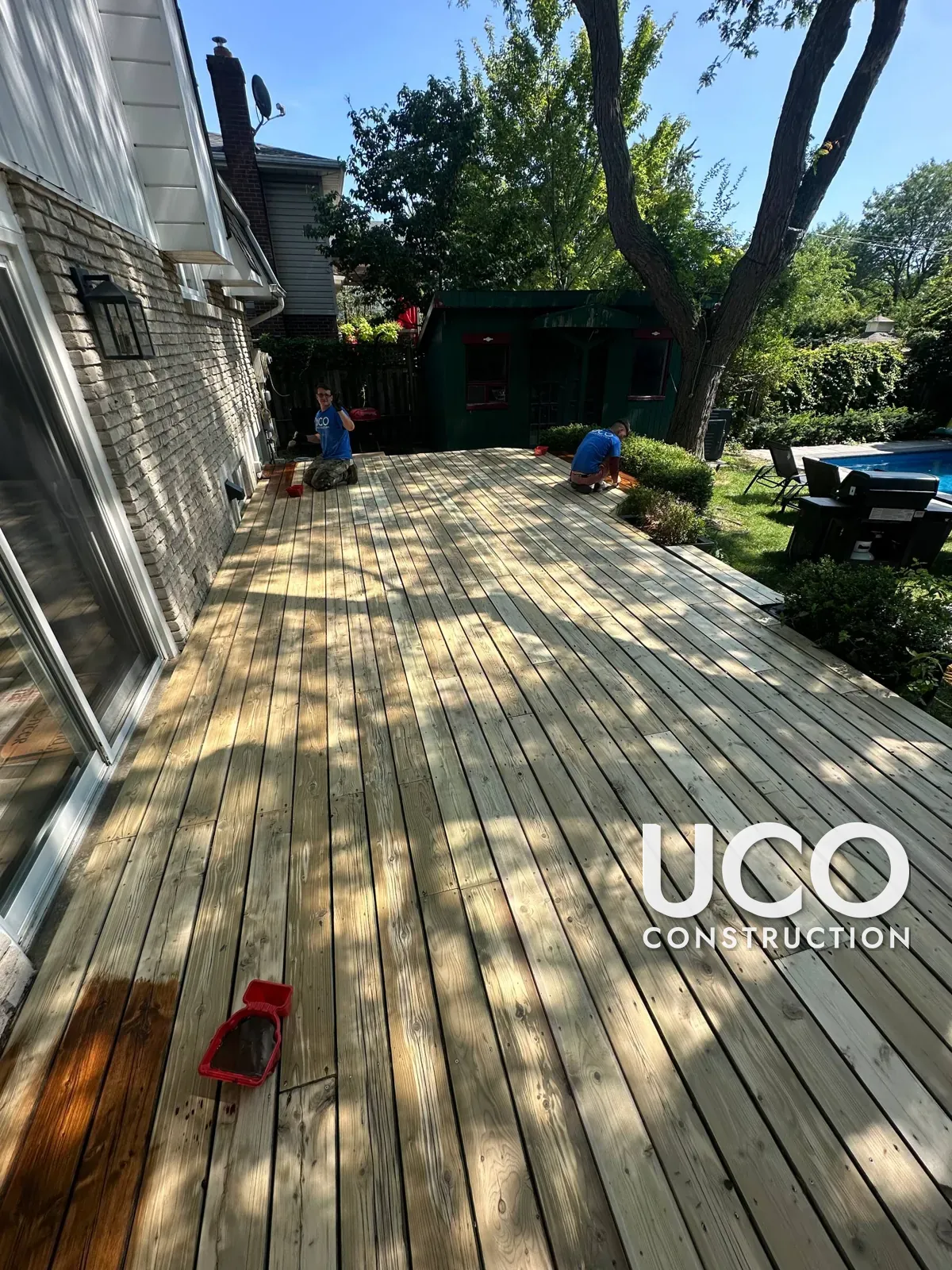 Pool-Side Deck Restoration in Mississauga: Grey Weathered Deck Sanded to Bare Wood, Rotten Boards Replaced and Refinished in a Warm Oil-Based Stain