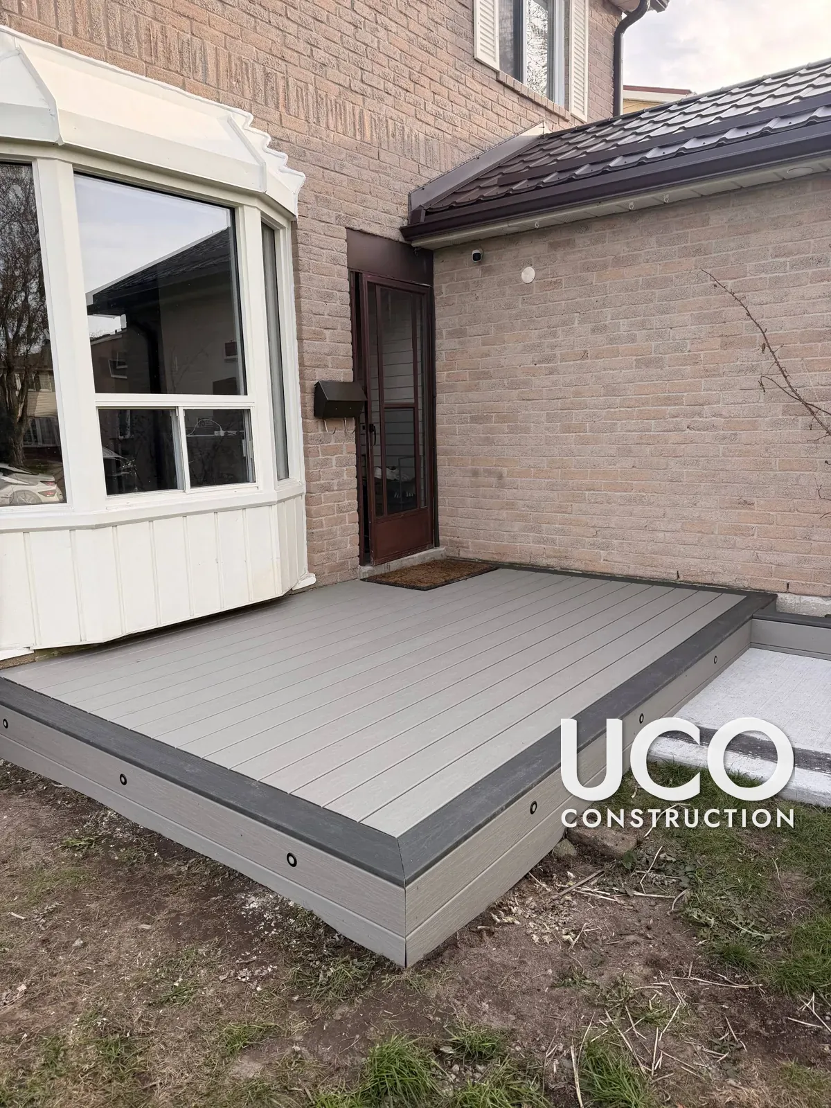 Trex Composite Deck Construction in Mississauga: Old Wood Entry Deck Replaced With a Low-Maintenance Composite Platform, Contrast Picture-Frame Border, Matching Fascia and Built-In Deck Lights