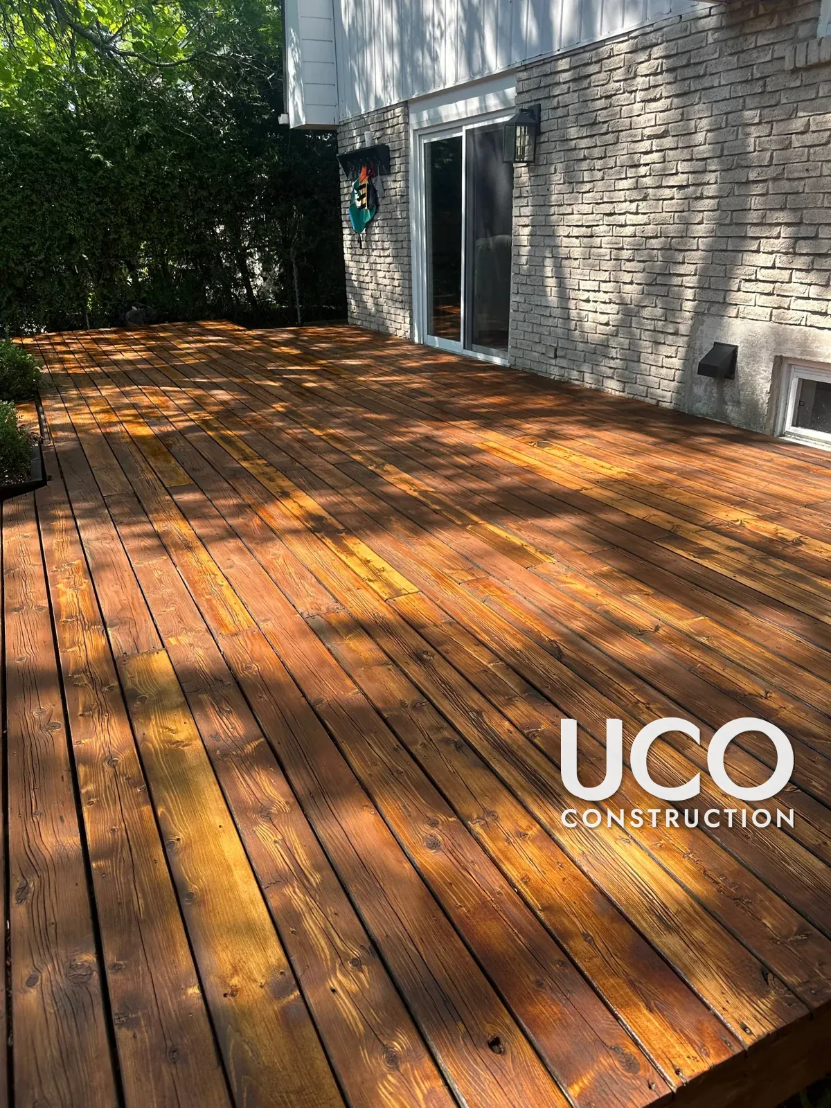 Pool-Side Deck Restoration in Mississauga: Grey Weathered Deck Sanded to Bare Wood, Rotten Boards Replaced and Refinished in a Warm Oil-Based Stain