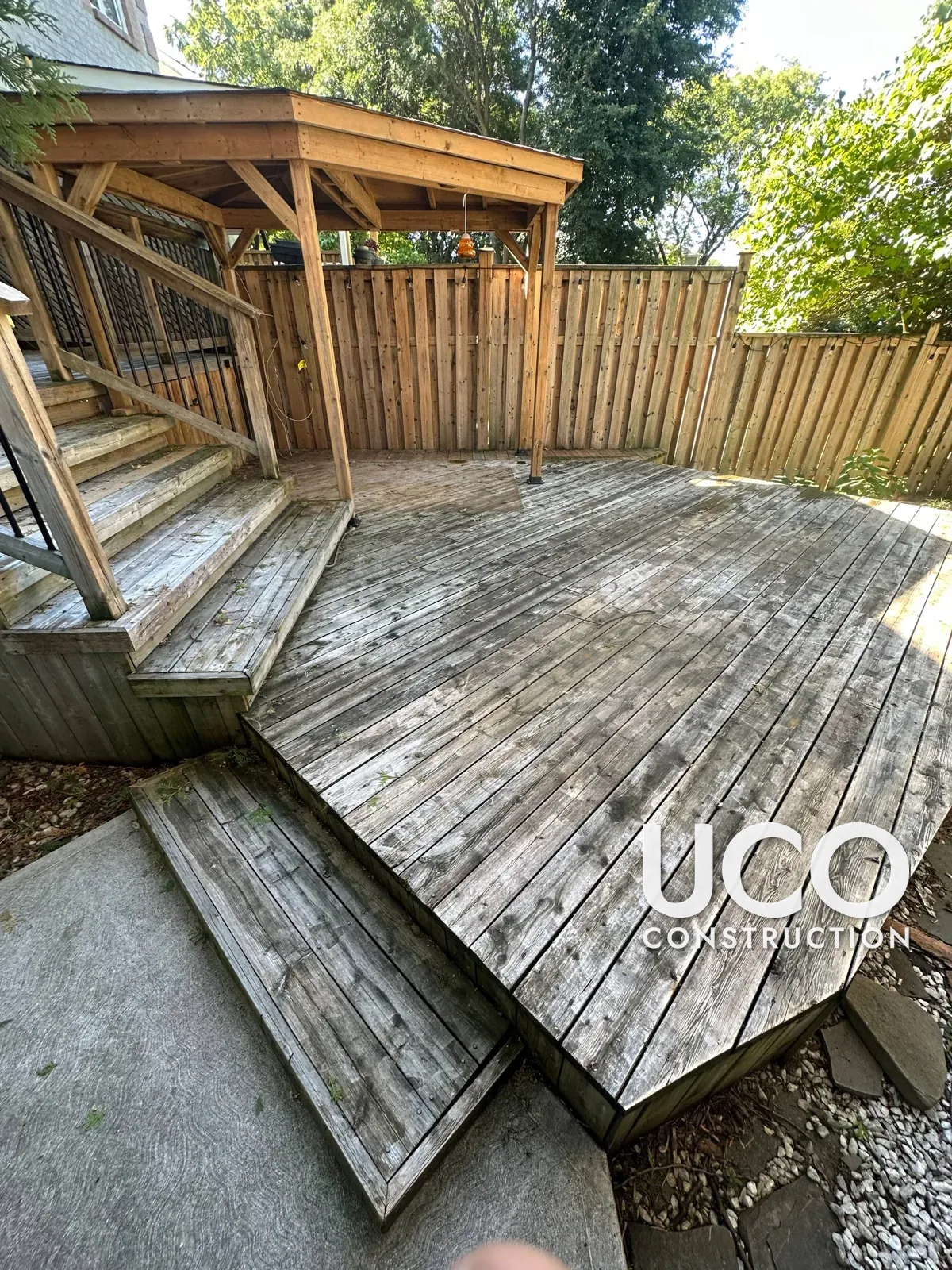 Deck Restoration in Mississauga: Grey Weathered Multi-Level Deck, Stairs, Railings, Pergola and Skirting Sanded to Bare Wood and Refinished in a Dark Brown Oil-Based Stain
