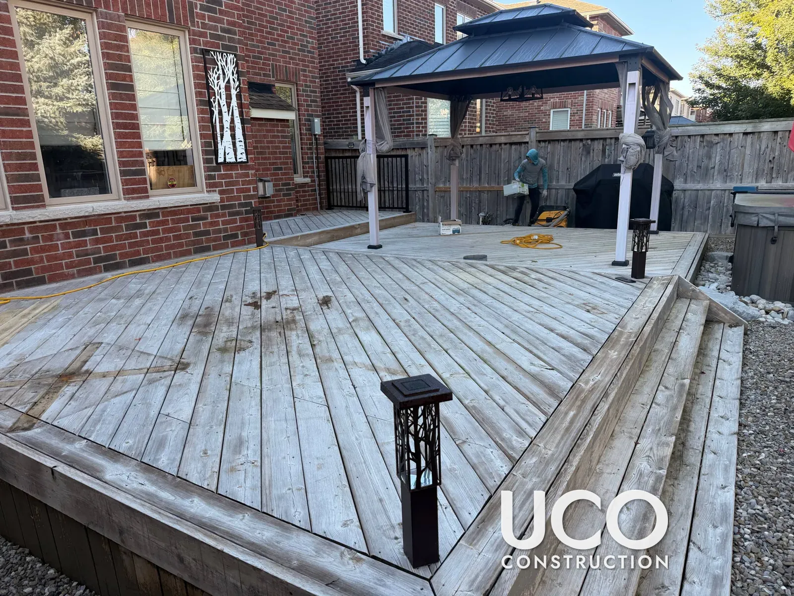 Deck Restoration in Georgetown: Grey Weathered Pressure-Treated Deck Sanded to Bare Wood and Refinished With Oil-Based Stain, Stairs and Skirting Included