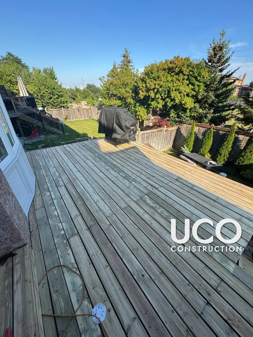 Deck Restoration and New Aluminum Railings in Woodbridge: Peeling Solid Stain Sanded Off, Deck Oil-Stained, Black Aluminum Railings and Stairs Installed