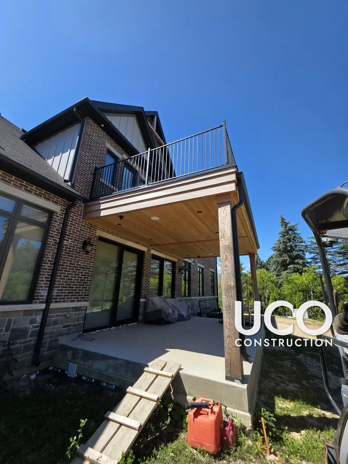 New-Build Exterior Wood Staining in Vaughan: Porch Posts, Covered Deck Ceiling, Beams and Gable Timbers Finished in Cutek Oil