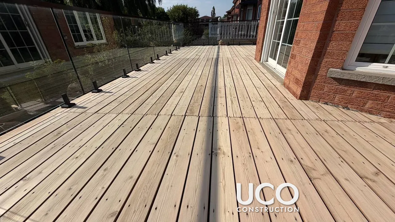First Stain on a One-Year-Old Cedar Deck in Vaughan: New Deck with Glass Railings Sanded and Finished Before It Greyed