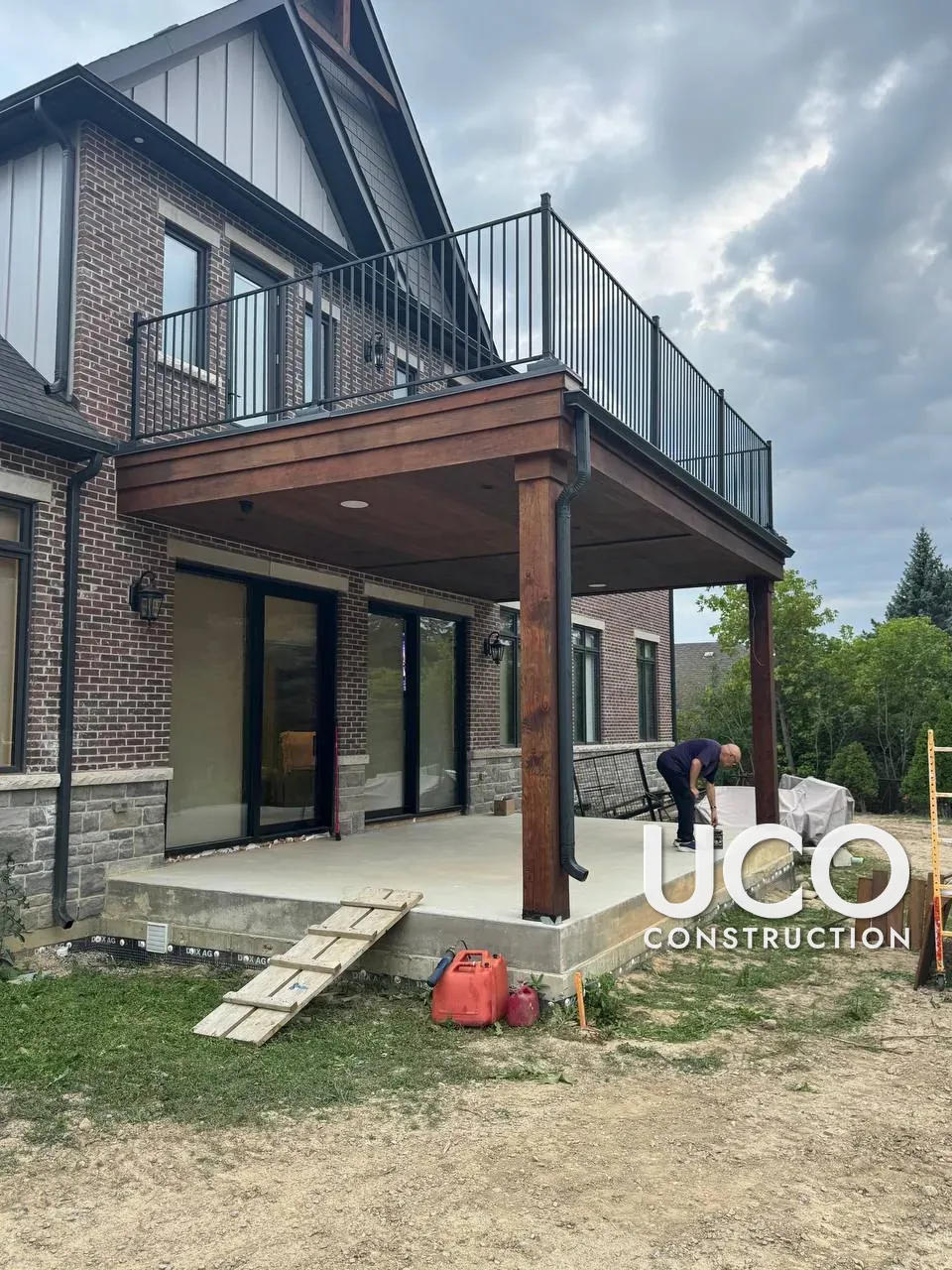 New-Build Exterior Wood Staining in Vaughan: Porch Posts, Covered Deck Ceiling, Beams and Gable Timbers Finished in Cutek Oil