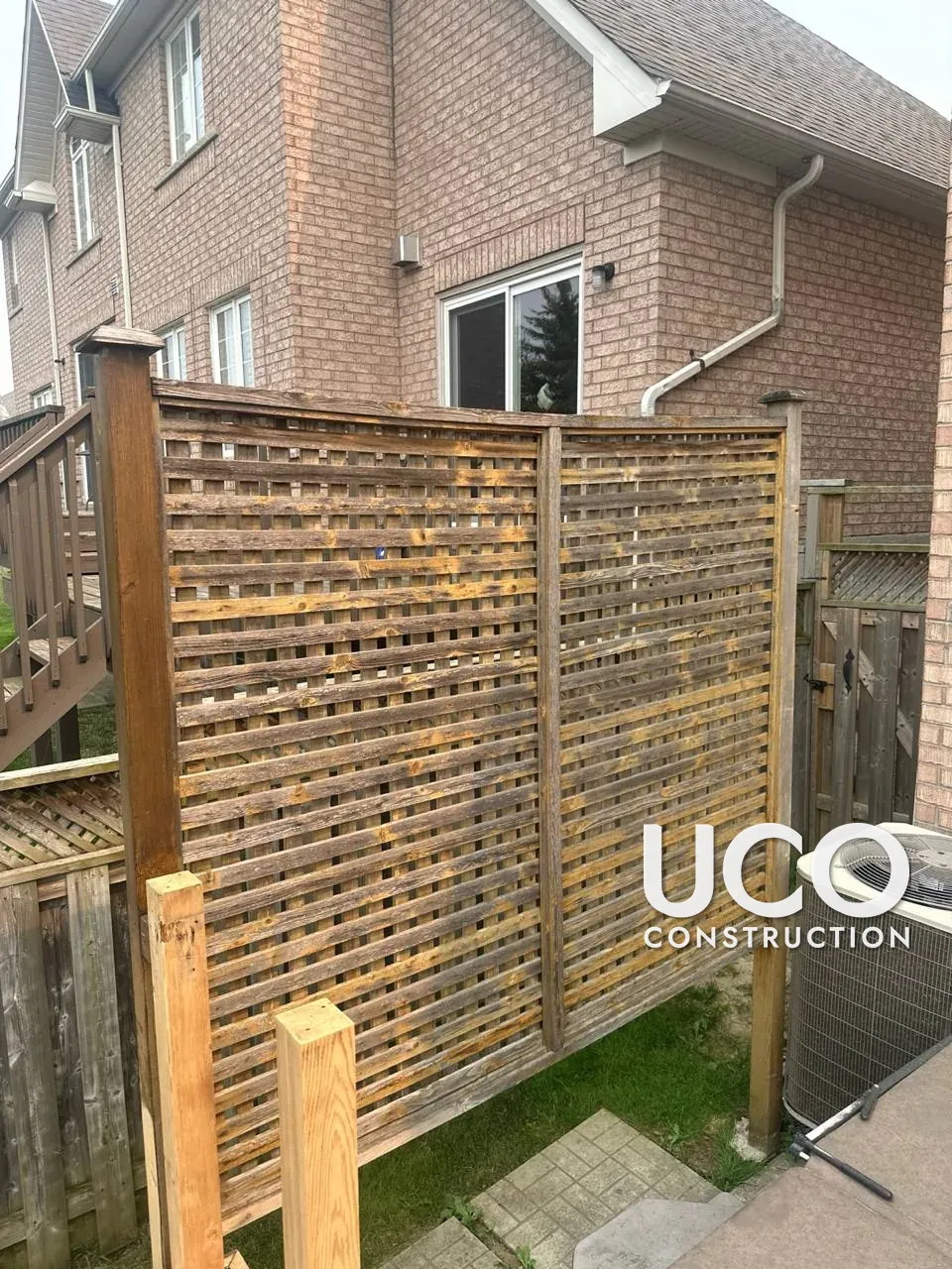 Deck Railings, Skirting and Privacy Screens Restained in Brampton: Grey Weathered Wood Around a Composite Deck Sanded and Stained