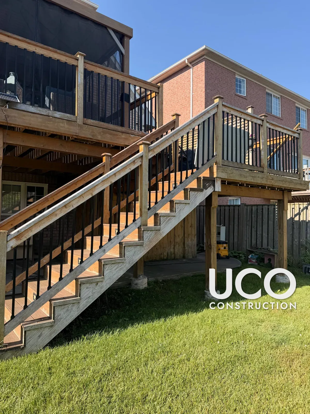 Deck Railings, Skirting and Privacy Screens Restained in Brampton: Grey Weathered Wood Around a Composite Deck Sanded and Stained