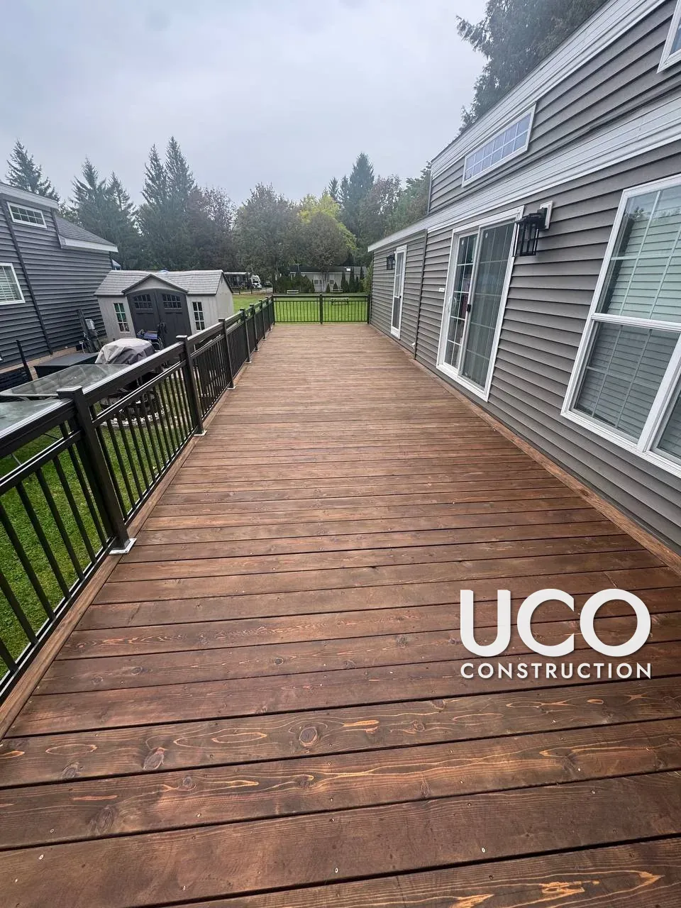 Deck Refinishing in Whitchurch-Stouffville: Long Pressure-Treated Deck Sanded and Restained with an Oil-Based Stain