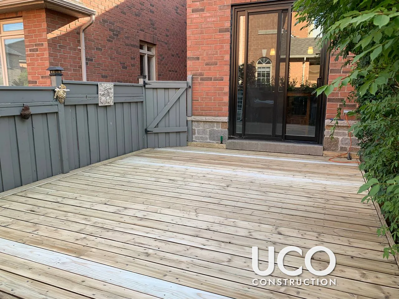 Deck Restoration in Thornhill: Peeling Red Stain Sanded Off, Damaged Boards Replaced and Deck Refinished in a Grey-Brown Semi-Transparent Stain