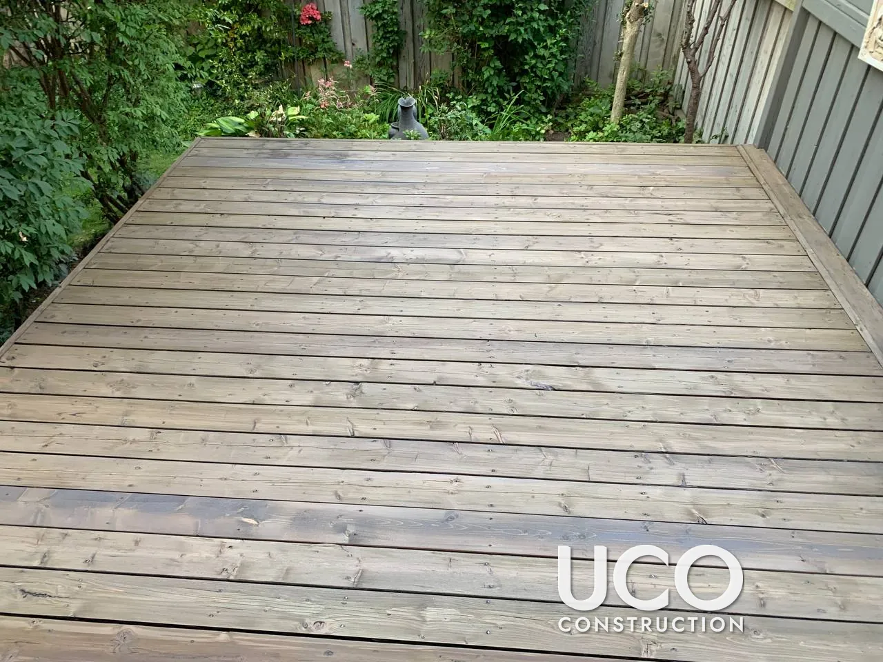 Deck Restoration in Thornhill: Peeling Red Stain Sanded Off, Damaged Boards Replaced and Deck Refinished in a Grey-Brown Semi-Transparent Stain
