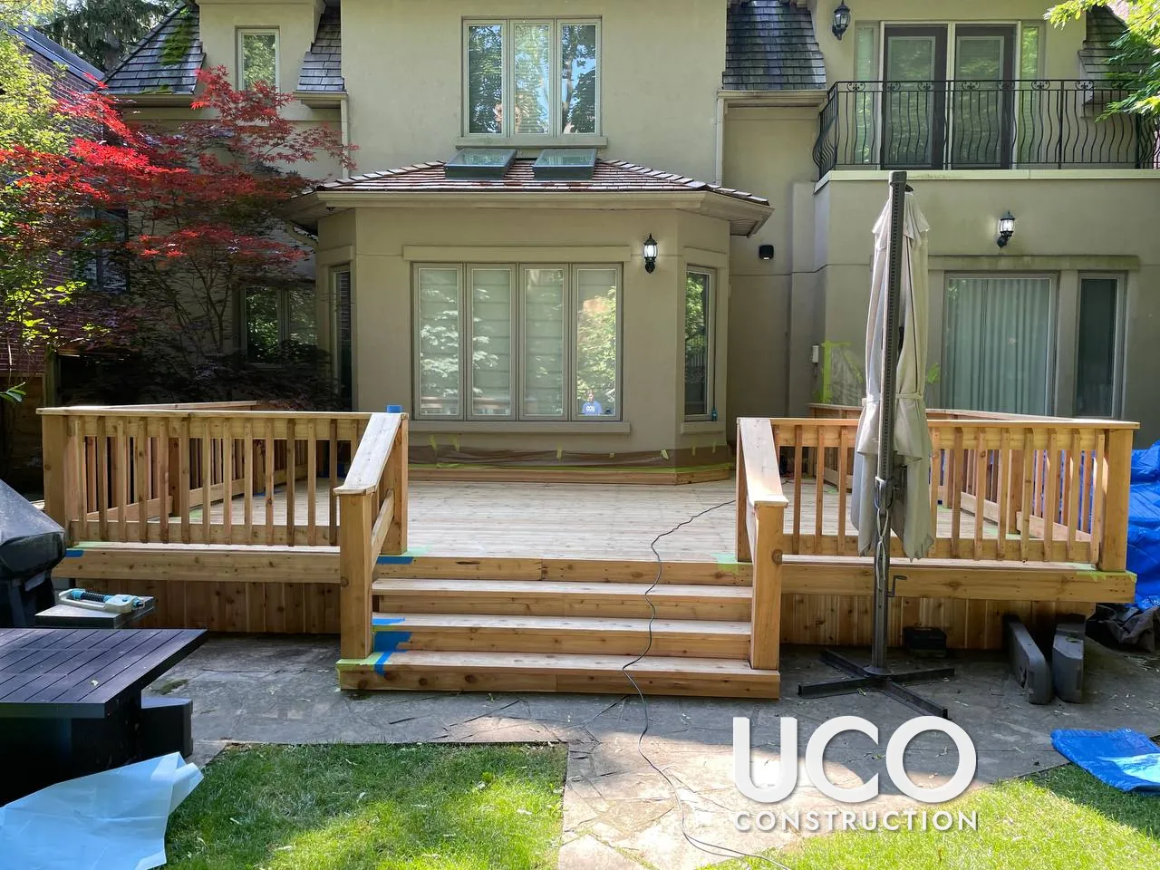 Cedar Deck Restoration in Toronto: Peeling Red Stain Sanded Off a Cedar Deck, Railings and Stairs, Refinished in a Driftwood-Brown Semi-Transparent Stain