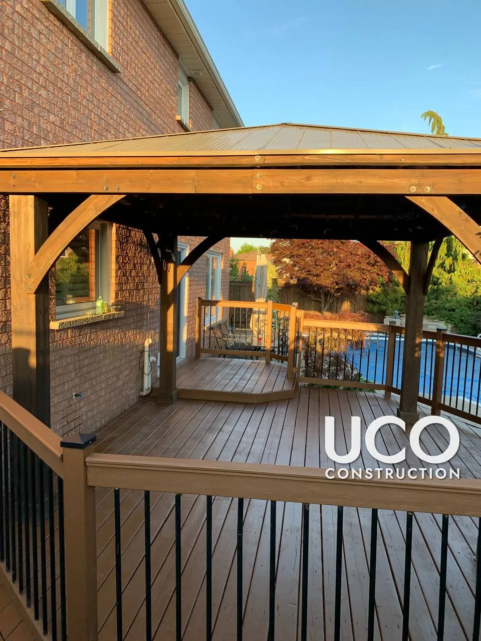 Deck and Gazebo Restoration in Bolton: Peeling Deck Stain Sanded Off, Wood Gazebo Posts and Brackets Refinished, Pool-Side Deck and Railings Stained in a Warm Oil-Based Stain