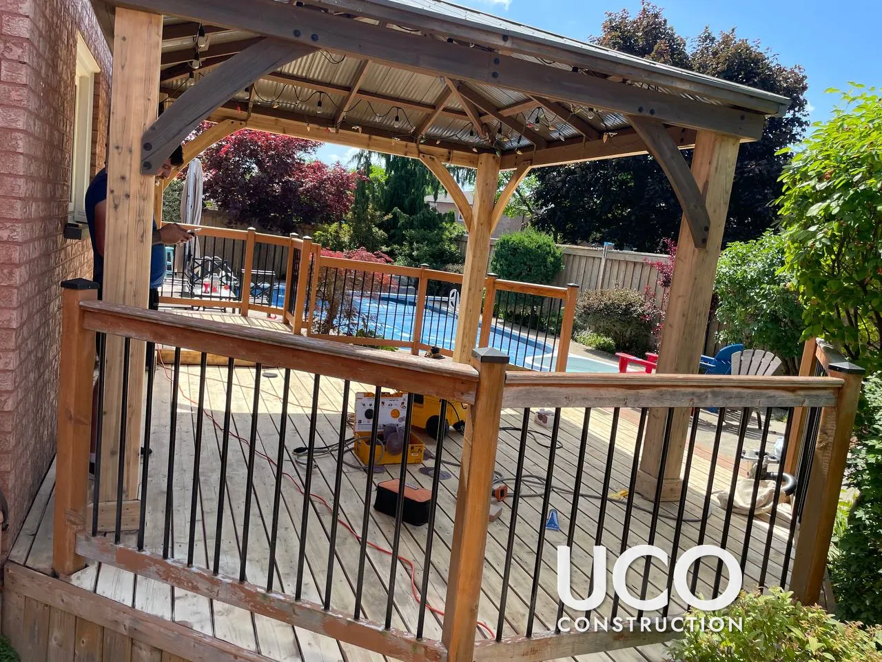 Deck and Gazebo Restoration in Bolton: Peeling Deck Stain Sanded Off, Wood Gazebo Posts and Brackets Refinished, Pool-Side Deck and Railings Stained in a Warm Oil-Based Stain
