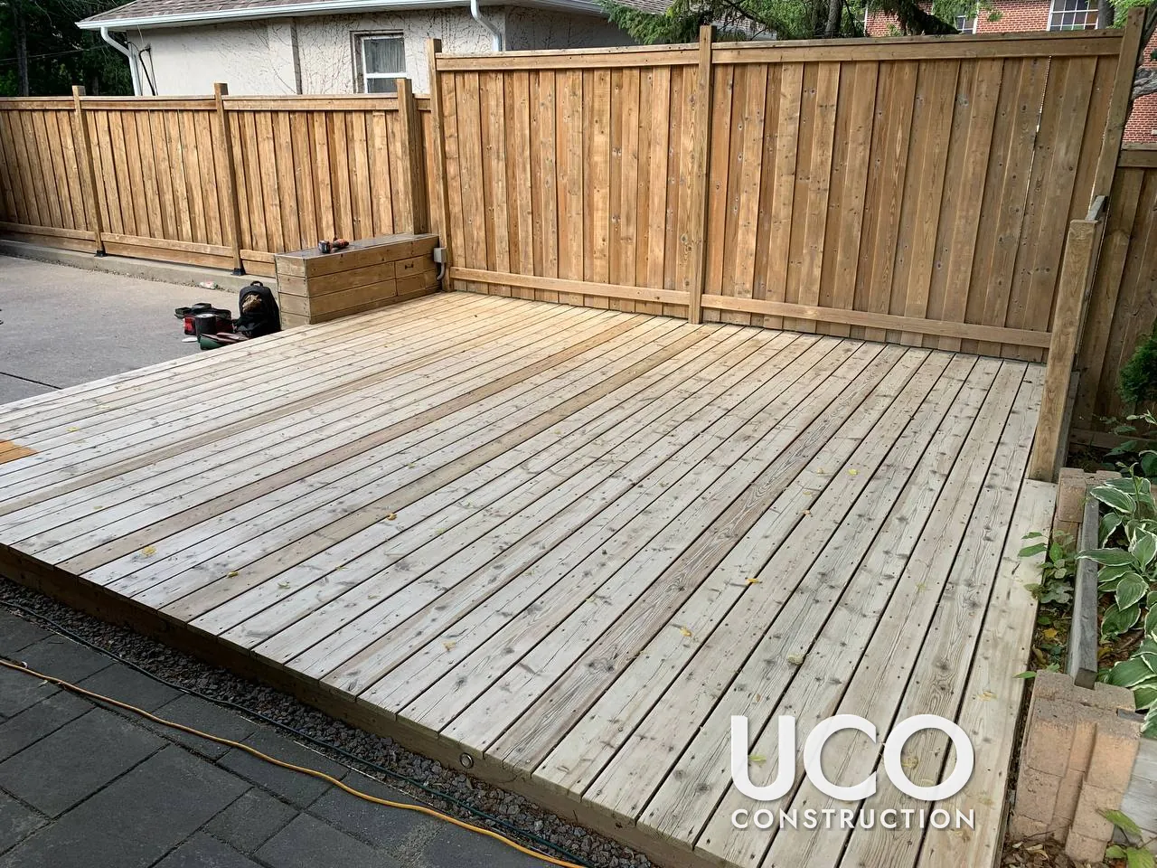 Deck Staining in Etobicoke: Weathered Grey Ground-Level Deck Pressure Washed, Sanded, Colour-Tested and Refinished in a Grey-Brown Oil-Based Stain