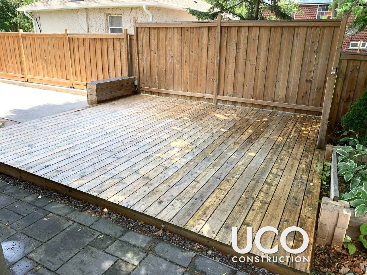 Deck Staining in Etobicoke: Weathered Grey Ground-Level Deck Pressure Washed, Sanded, Colour-Tested and Refinished in a Grey-Brown Oil-Based Stain
