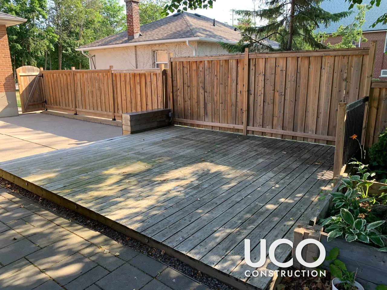 Deck Staining in Etobicoke: Weathered Grey Ground-Level Deck Pressure Washed, Sanded, Colour-Tested and Refinished in a Grey-Brown Oil-Based Stain