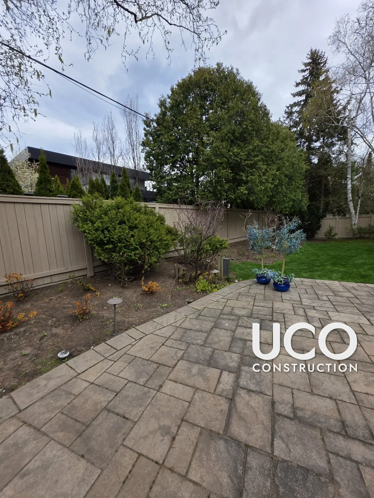 Fence Staining in Oakville: Weathered Grey Privacy Fence Cleaned, Power Washed and Refinished in a Taupe Solid Stain