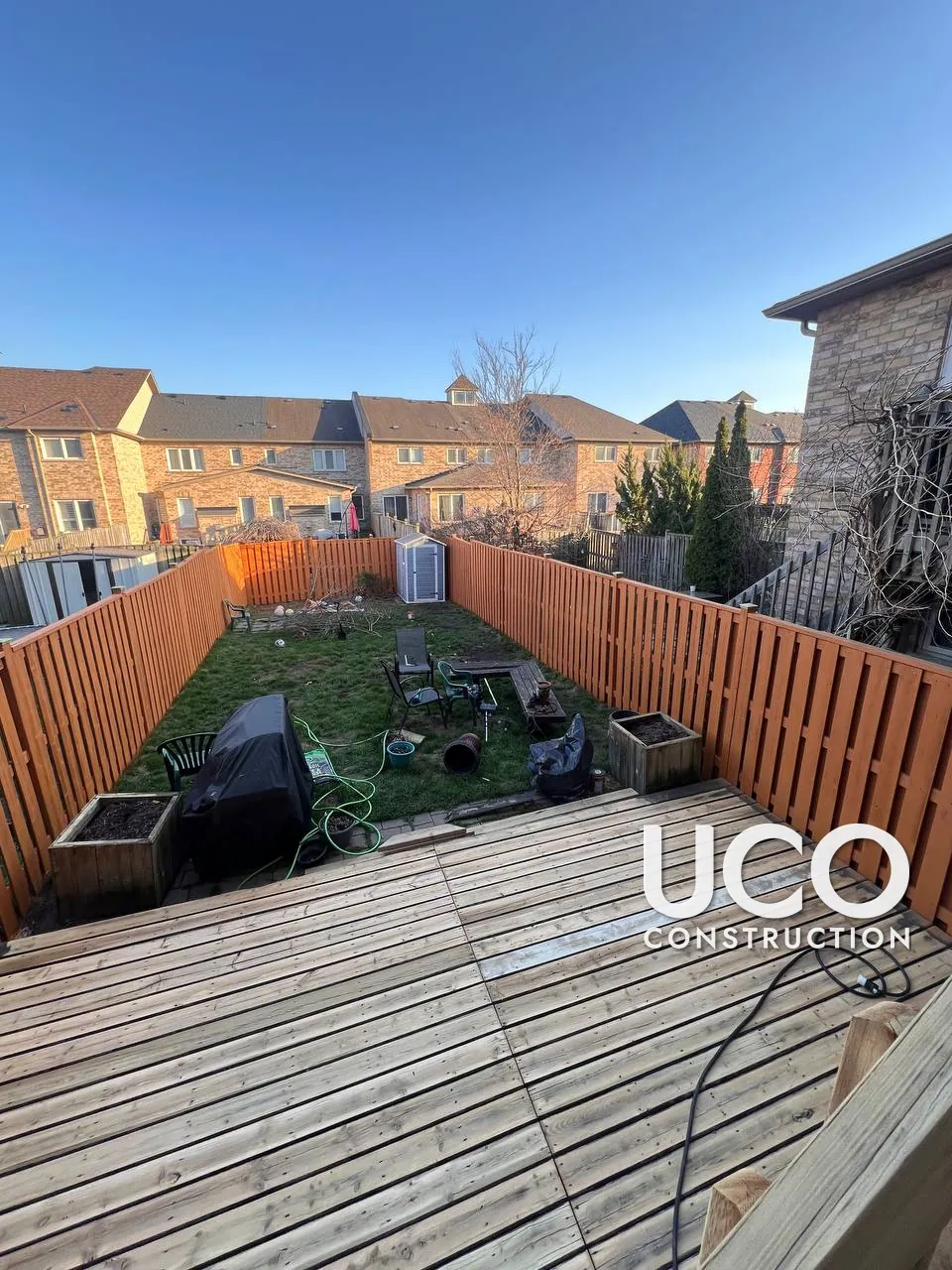 Deck Staining in Ajax: Dark, Peeling Deck Stain Sanded Off to Bare Wood and Refinished in a Warm Cedar Oil-Based Stain
