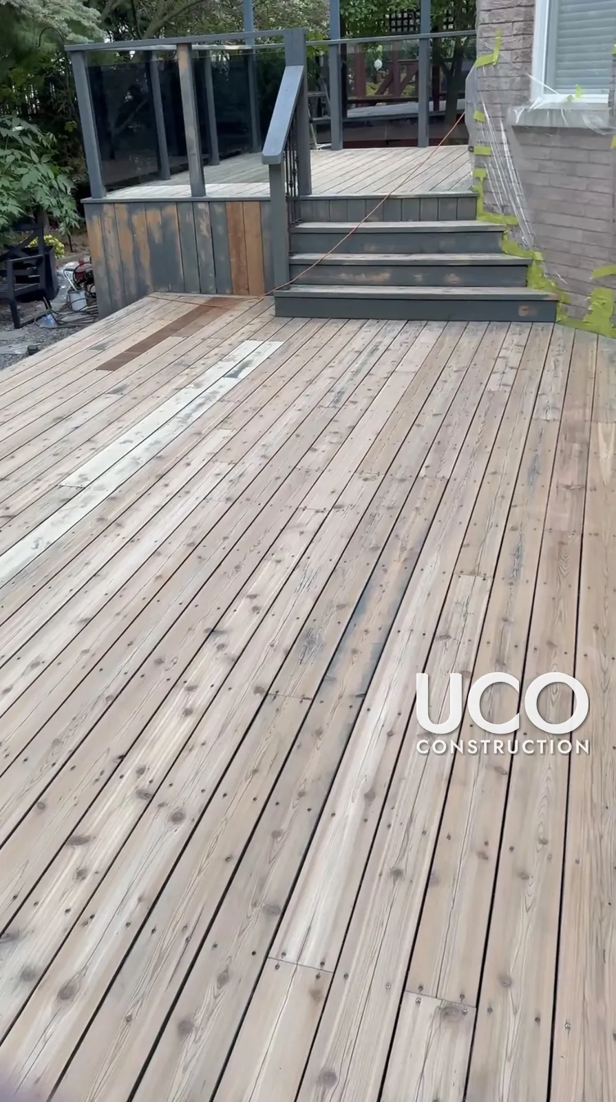 Deck Staining in Richmond Hill: Worn Multi-Level Deck With Pergolas and Wraparound Stairs Sanded and Refinished in a Slate Grey Solid Stain