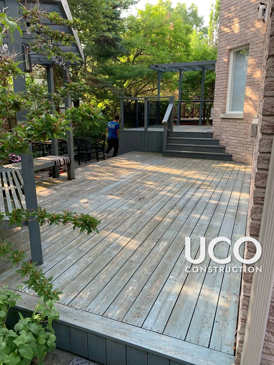 Deck Staining in Richmond Hill: Worn Multi-Level Deck With Pergolas and Wraparound Stairs Sanded and Refinished in a Slate Grey Solid Stain