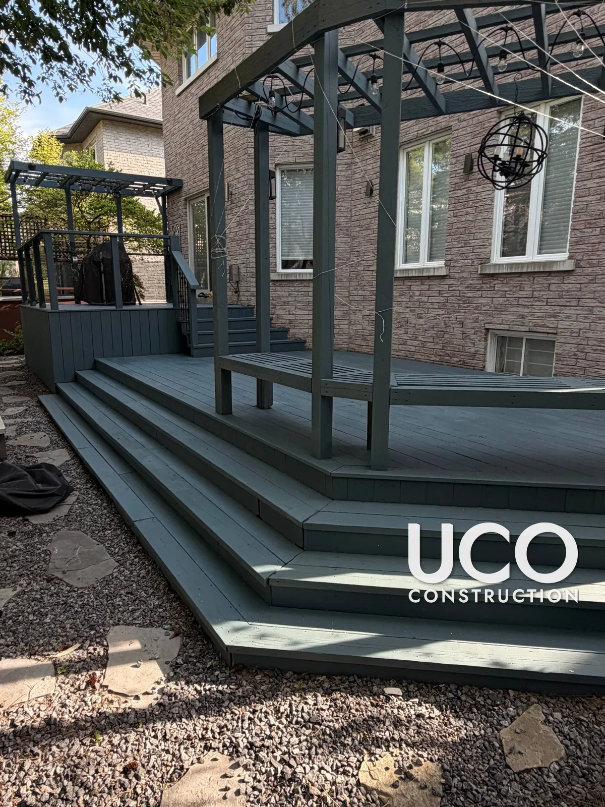 Deck Staining in Richmond Hill: Worn Multi-Level Deck With Pergolas and Wraparound Stairs Sanded and Refinished in a Slate Grey Solid Stain