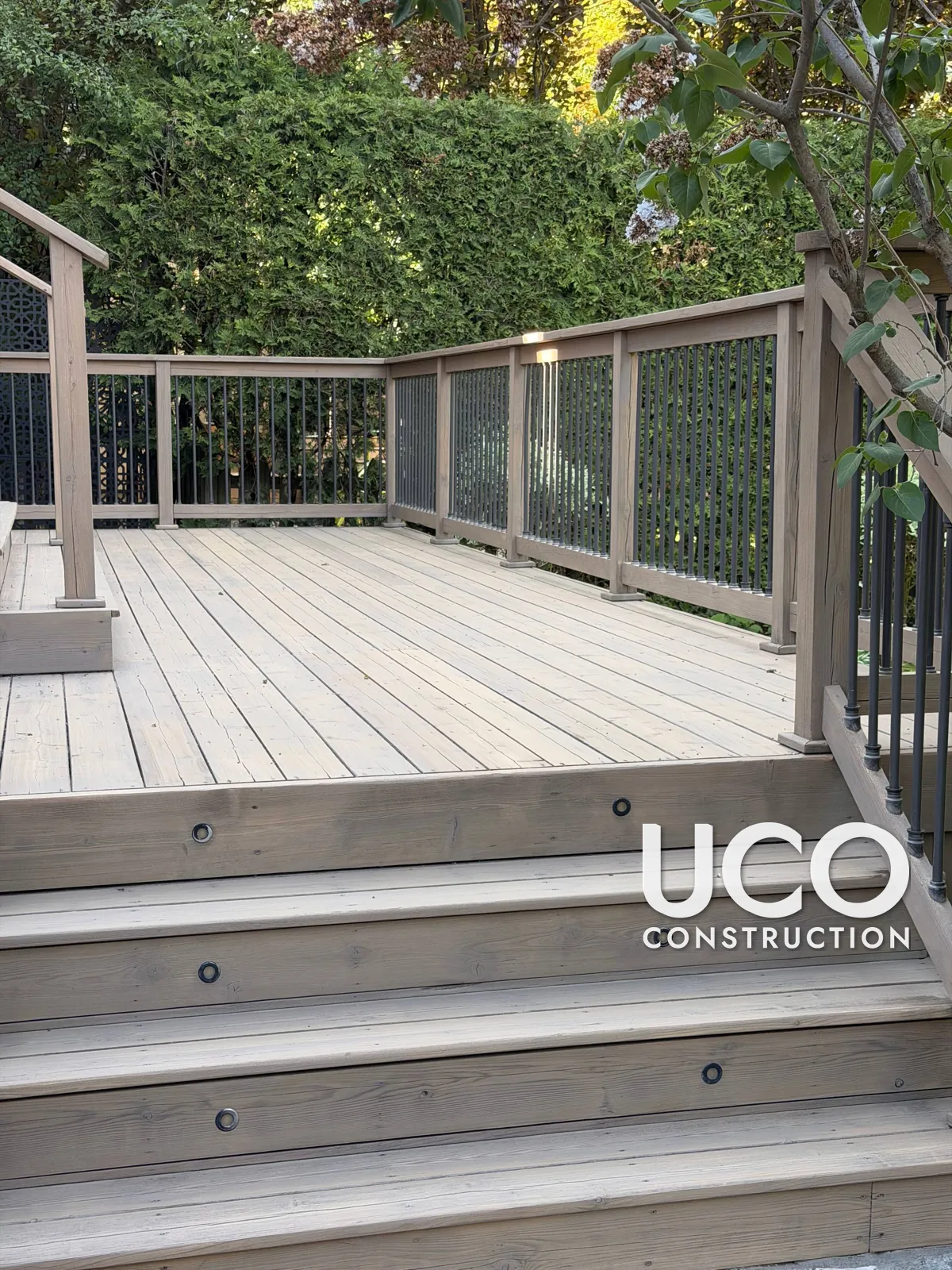 Deck Staining in Toronto: Weathered Two-Level Deck, Stairs and Railings Sanded and Refinished in a Modern Greige Stain