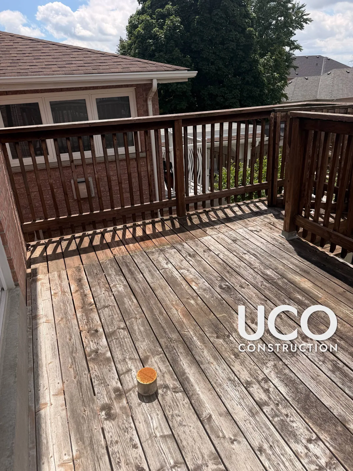 Deck Resurfacing in Woodbridge: Weathered Pressure-Treated Raised Deck Resurfaced With Trex Composite Boards, New Wood Railings and Stain