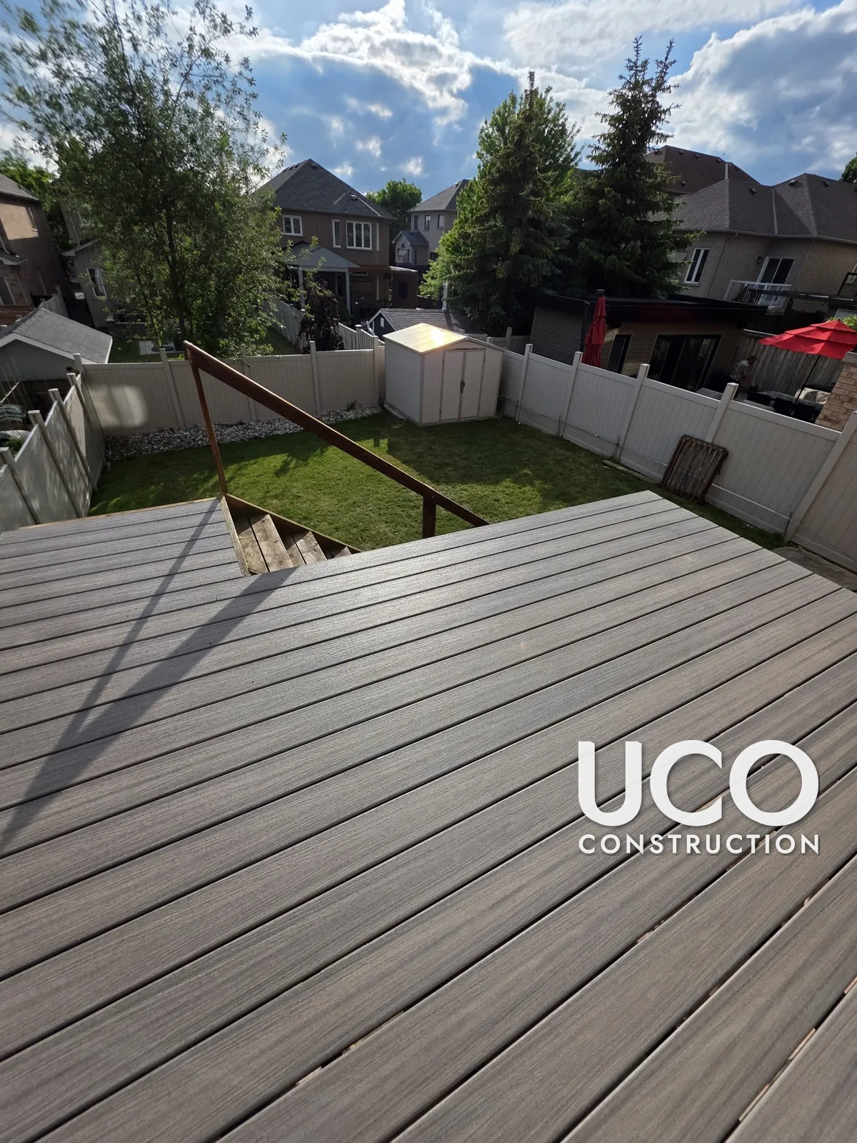 Deck Resurfacing in Woodbridge: Weathered Pressure-Treated Raised Deck Resurfaced With Trex Composite Boards, New Wood Railings and Stain